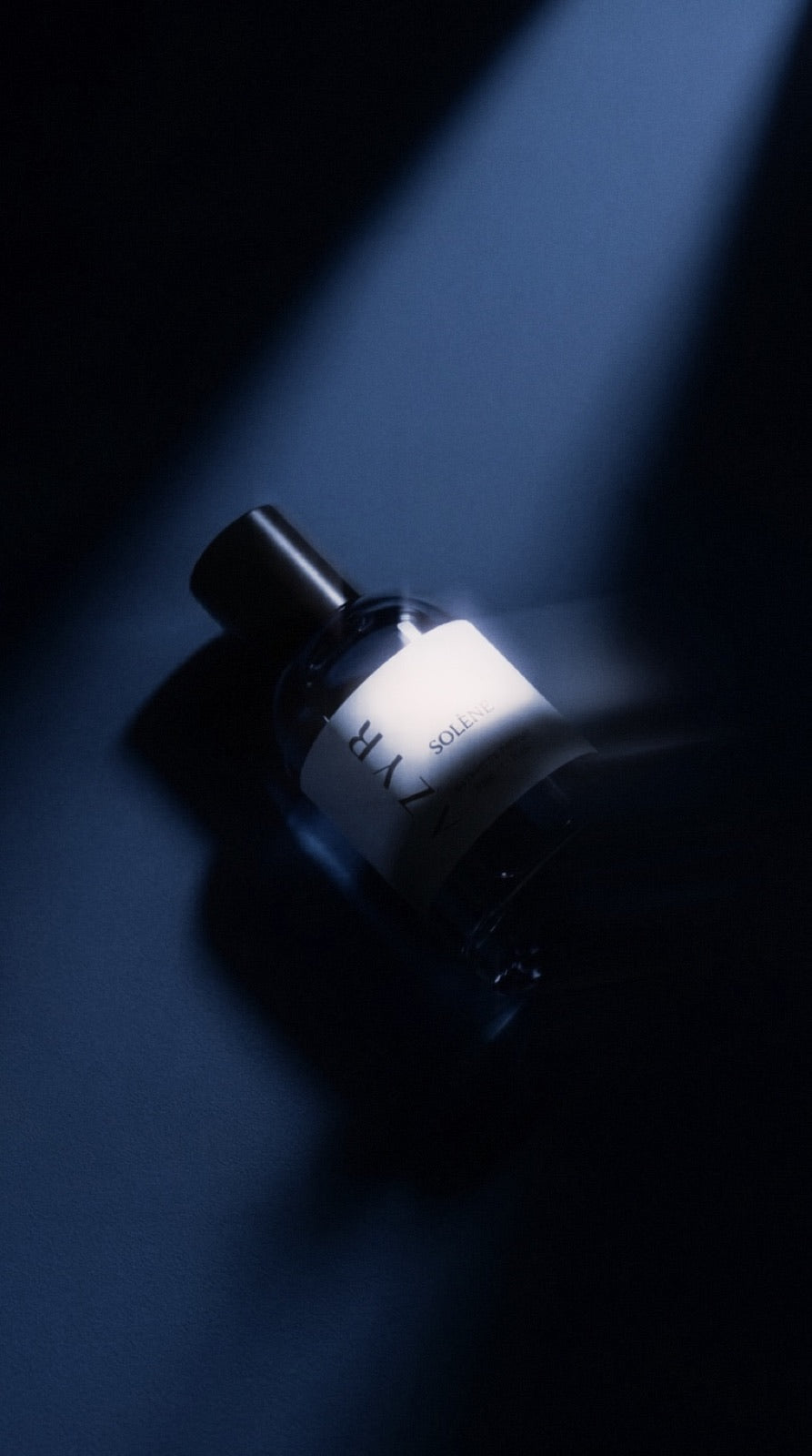 AZYR bottle lit by a single beam of light on a dark surface