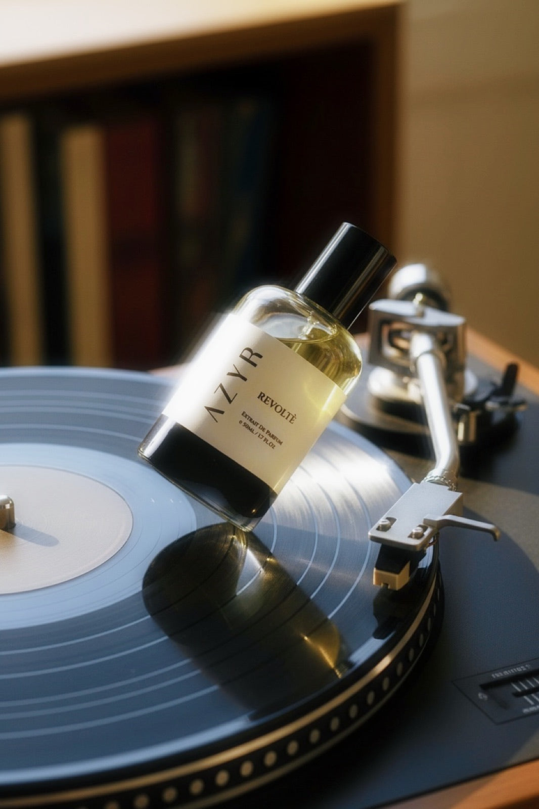 Revoltè bottle resting on a turntable record
